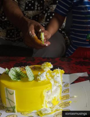 The grandfather celebrating his birthday with the grandson