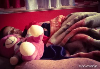 The sick toddler cudding his new friend 