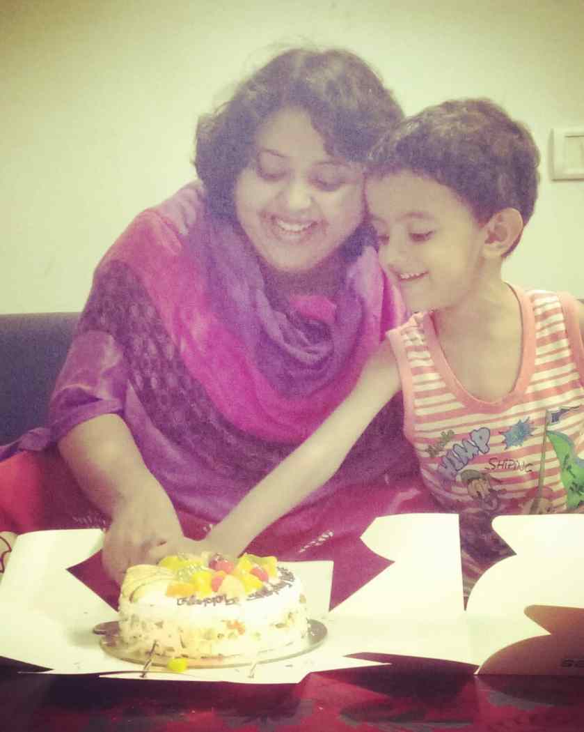 Cutting my birthday cake with the toddler